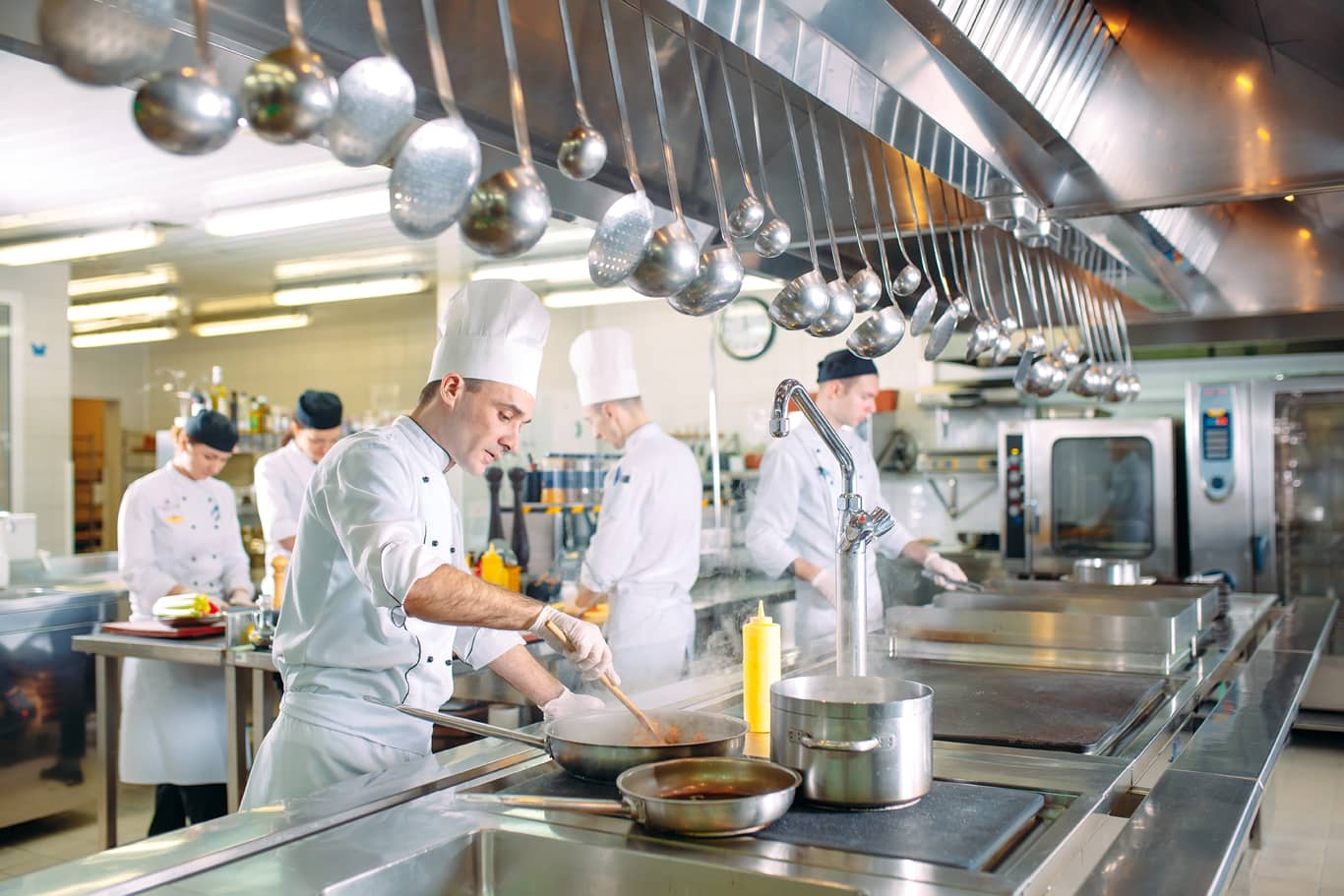 Photo of chefs in resturaunt kitchen